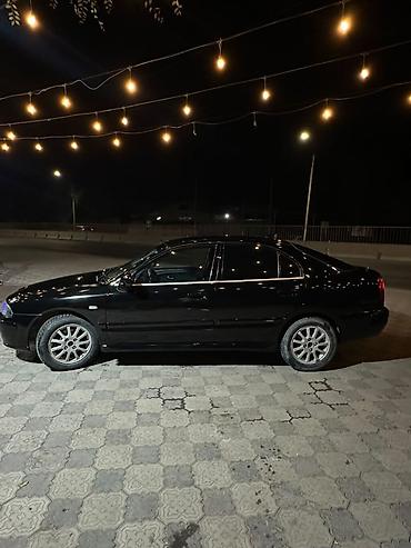 диска на авто: Mitsubishi Carisma: 2003 г., 1.8 л, Автомат, Бензин, Лифтбек — 4