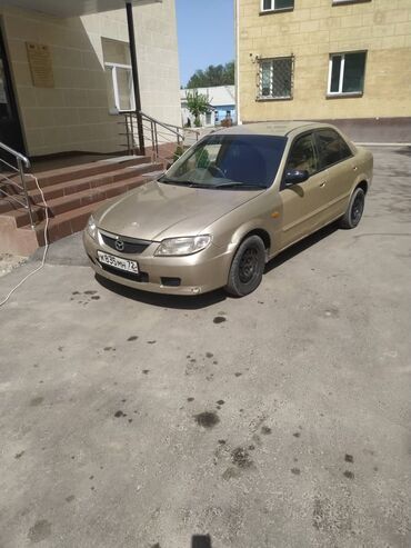 мазда 323 1 8: Mazda Familia: 2003 г., 1.5 л, Автомат, Газ, Седан