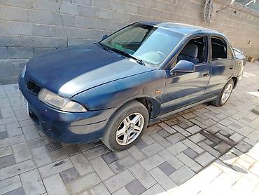 харизма: Mitsubishi Carisma: 1997 г., Механика, Седан — 2