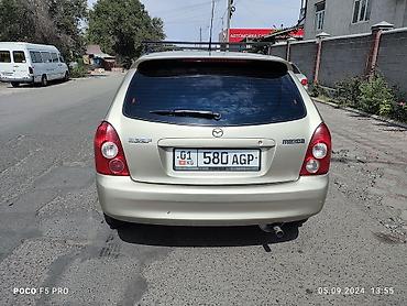 шторка фит: Mazda 323: 2003 г., 1.6 л, Механика, Бензин, Универсал — 6