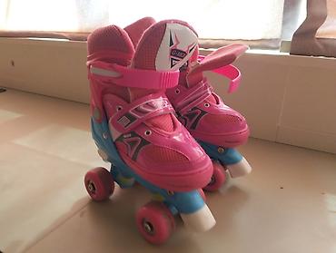 roller skates: Uşaq dördtəkərli konkisurətləri (roller skates).təp təzədi.2 dəfə — 2