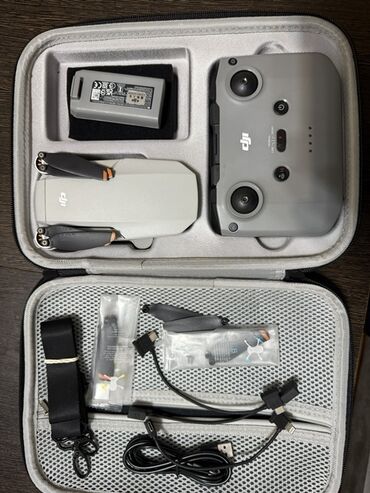 фантом 3: Компактный дрон DJI Mini 2 в комплектации Fly More Combo, выполненный