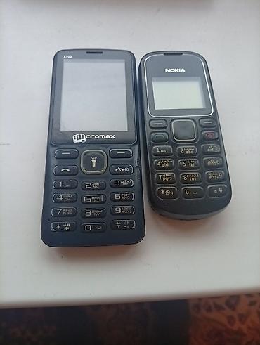 Nokia 700, Б/у, 2 ГБ, цвет - Черный, 1 SIM, 2 SIM