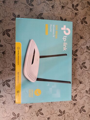 modem ustası: TP-Link brendinin ağ rəngli, 300 Mbps sürətli simsiz N routerı. Bu
