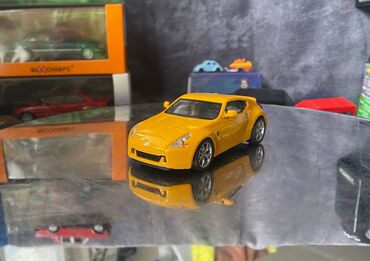 ахунбаева малдыбаева квартиры: Коллекционная модель Nissan 370Z Z34 yellow 2008 DeAgostini Scale