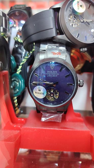 bakida saat: Saat: “Rolex Oyster Perpetual LabelNoir” üslubunda mexaniki qol saatı — 1