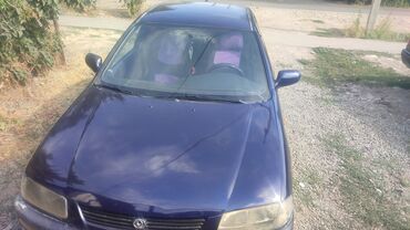 деу нексия 1: Mazda 323: 1996 г., 1.5 л, Автомат, Бензин, Седан