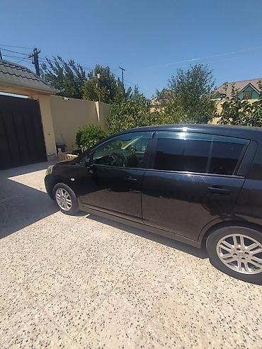 disk: Nissan Tiida hatchback - Kuzov: 5 qapılı hatchback, qara rəng - — 5