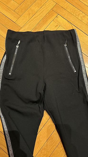 Pantalone, Farmerke, Šortsevi: Crne ženske helanke/pantalone uskog kroja sa dekorativnim srebrnim — 2
