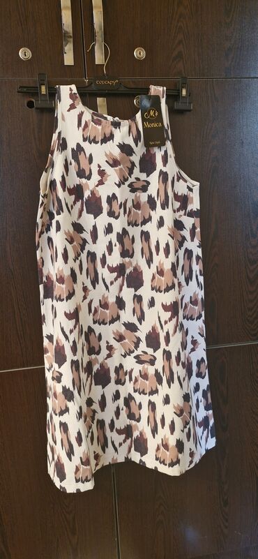 Köynək və bluzalar: Leopard printli qadın maykası. Açık rəngdə və qəhvəyi tonlarda xal