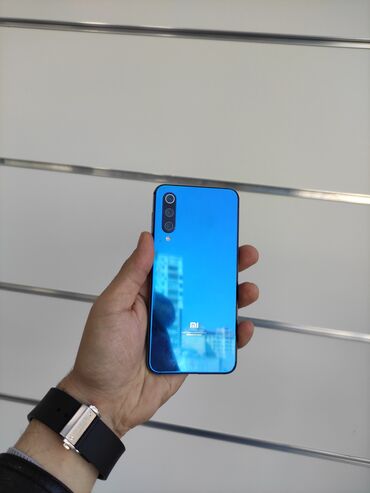 телефон флай еззи 7: Xiaomi Mi 9 SE, 64 ГБ, цвет - Голубой