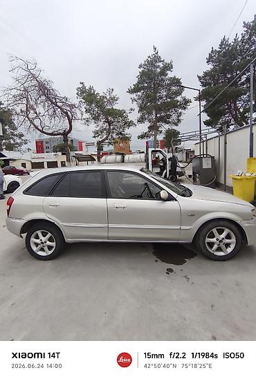 e53 amg: Mazda Familia: 2001 г., Универсал — 5