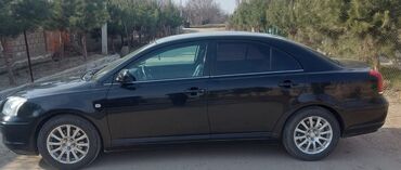 купить багажник на крышу авто в бишкеке: Черный седан Toyota Avensis с тонированными стеклами, оборудованный