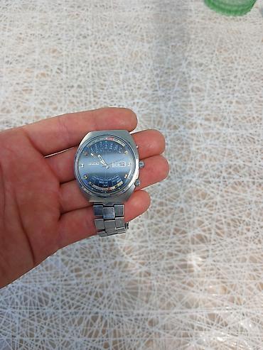 orient gence: Orient brendinin gümüşü rəngli polad bilərzikli qol saatı. Bu model — 3