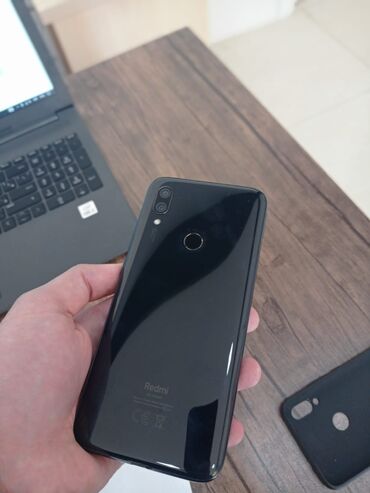 Xiaomi: Xiaomi Redmi 7, 32 ГБ, цвет - Черный, 
 Отпечаток пальца, Две SIM карты