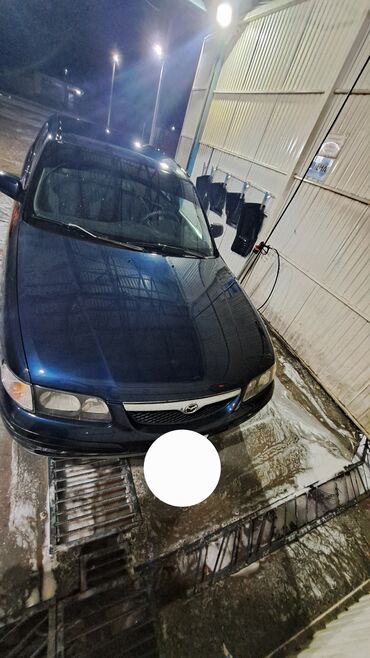покрышка на жигули: Mazda Capella: 1998 г., 1.8 л, Механика, Бензин, Седан