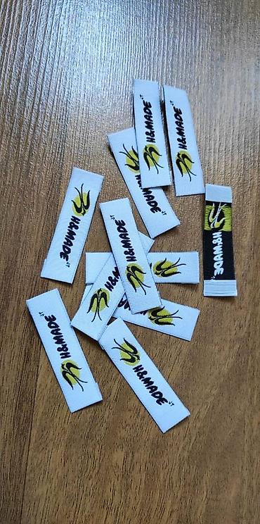 Другие услуги пошива одежды: Жаккардовые этикетки, и основа и логотип вышиваются нитями, главное — 23