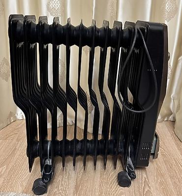 delonghi radia s: Yağlı radiator tipli elektrikli qızdırıcı - Rəng: qara, metalik ön — 1