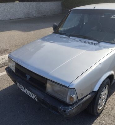 Tofas: Tofaş Şahin/Doğan (sedan) – gümüşü rəng Xüsusiyyətlər: - Kuzov: 4 — 7