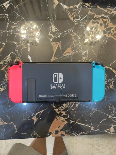 Nintendo Switch: Salam. Nintendo switch teze version demek olarki cox