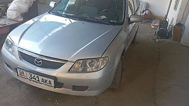 протер 2: Mazda 323: 2002 г., 1.6 л, Механика, Бензин, Хэтчбэк — 1