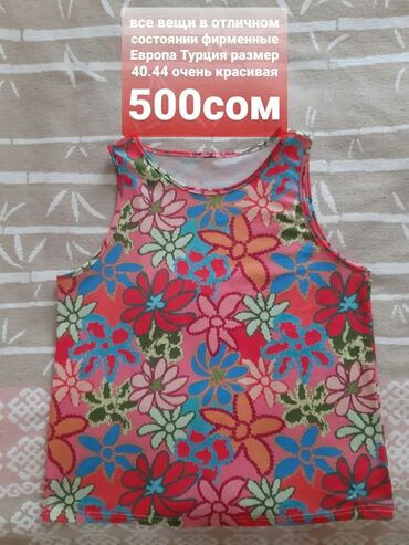 Другая женская одежда: Джинсовый комбинезон синего цвета с классическим дизайном. Модель — 26