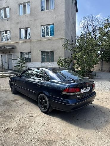 зеркела: Mazda 626: 1997 г., 1.8 л, Кол менен иштөөчү, Седан — 4
