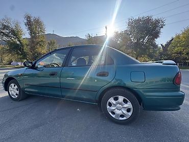 плуг для мтз трактора: Mazda 323: 1997 г., Механика, Бензин, Седан — 10