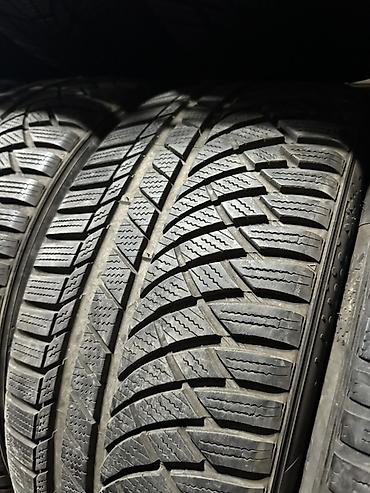Унаа: Зимние шины 255/45 R19 - Размер: 255/45 R19 (подпись на стеллаже). - — 2