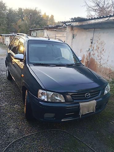 дом в колесах: Mazda Demio: 2000 г., 1.3 л, Механика, Бензин, Универсал — 3