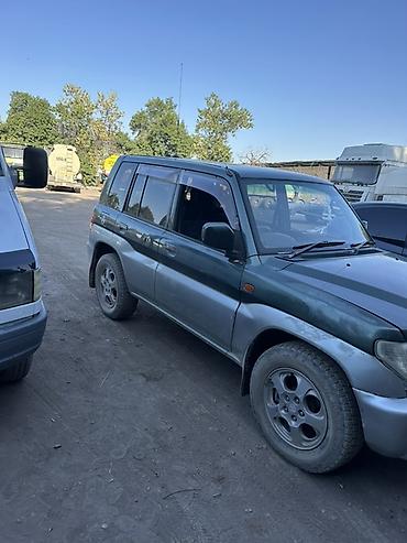 Транспорт: Mitsubishi Pajero iO: 2002 г., Автомат, Бензин, Внедорожник — 2