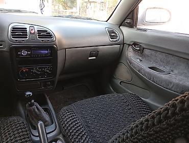 Daewoo: Daewoo Nubira sedan - Kuzov: 4 qapılı sedan, ağ rəng - Ban dizaynı — 8