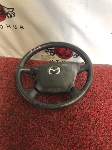 Другие автозапчасти: Руль с аирбагом Mazda Familia BJ5W 1500 2000 (б/у) САЛОННЫЕ ДЕТАЛИ -