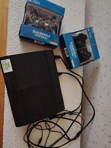 ps 3 cd: Sony PlayStation 3 Super Slim konsolu + 2 ədəd DualShock 3 simsiz pult — 1