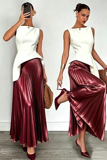 Elegantna plisirana maxi suknja sa satenskim sjajem
2300din