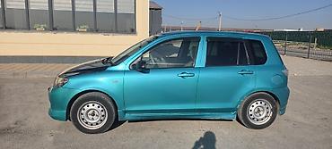 калганы: Mazda Demio: 2003 г., Автомат, Бензин — 7