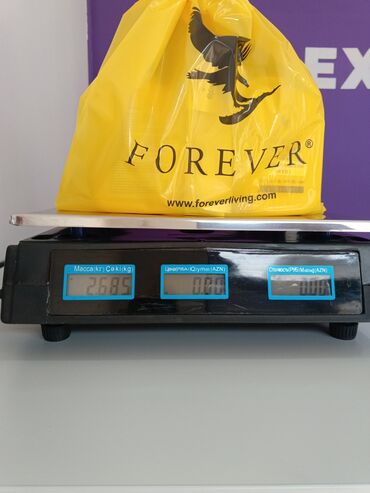 Vitaminlər və BAƏ: Forever Living şirkətinə məxsus sarı rəngli Aloe Vera Gel içkisi. Bu — 5