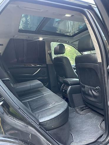 tesla model x: BMW X5 (E53) – qara rəngli, tam ölçülü premium SUV. Texniki və dizayn — 6
