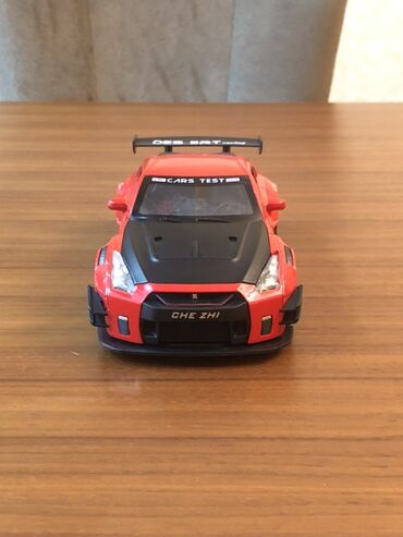 заказать модель машины: Oyuncaq model avtomobil – sport üslubunda qırmızı “CHE ZHI” GT-R tipli
