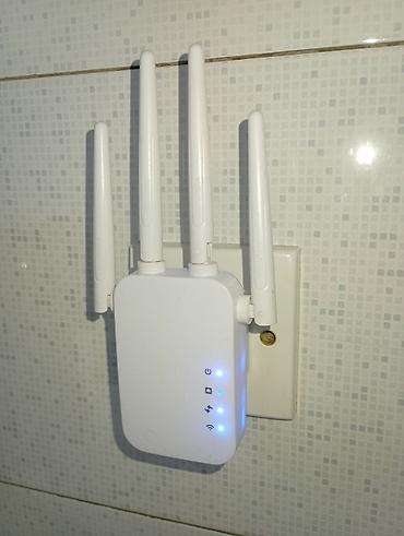 Wi‑Fi siqnal gücləndirici / range extender - Divar prizinə qoşulan