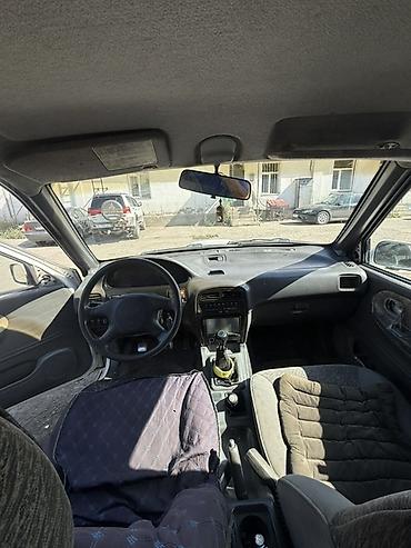 танден: Kia Sportage: 1995 г., 2 л, Механика, Дизель, Внедорожник — 5