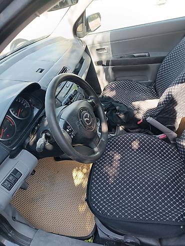 урус машина: Mazda Verisa: 2003 г., 1.3 л, Кол менен иштөөчү, Бензин, Хетчбек — 6