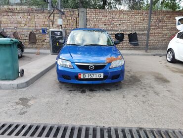 срочно срочно продам машину: Mazda 323: 2003 г., 1.6 л, Механика, Бензин, Седан
