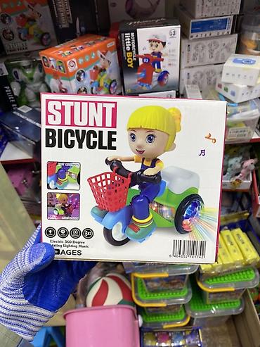 Музыкальная игрушка **Stunt Bicycle** — яркий детский трёхколёсный