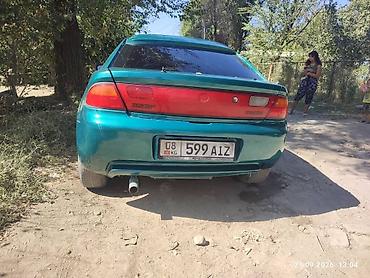 зарядка электровелосипеда: Mazda 323: 1996 г., 1.8 л, Механика, Бензин, Седан — 4