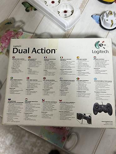 nintendo controller: Logitech Dual Action — проводной геймпад для ПК и Mac. Особенности: - — 2