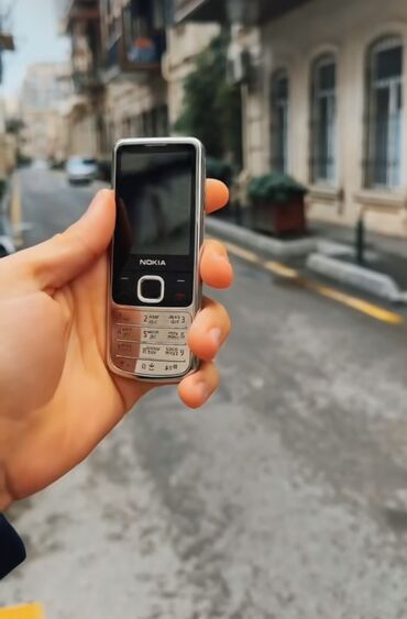 gence telefon: Nokia 6700 Slide, 2 GB, rəng - Gümüşü, Düyməli