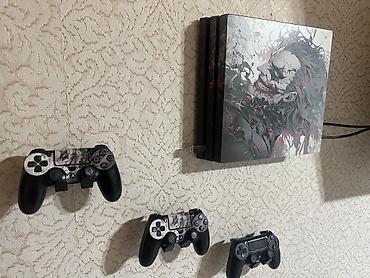 ps4 oyun diskləri: - PlayStation 4 Pro oyun konsolu, üst paneldə xüsusi Joker temalı — 1