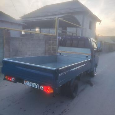 кемпинг дом на колесах: Hyundai Porter II — компактный бортовой грузовичок синего цвета — 4