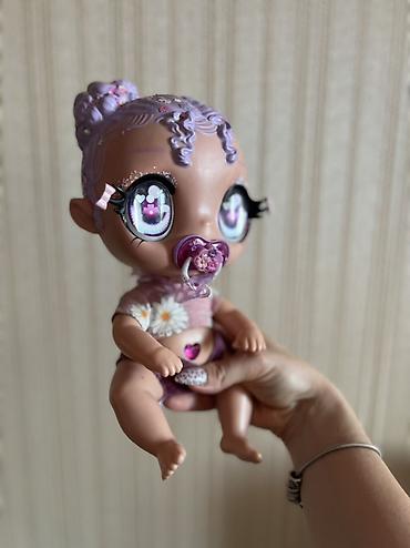 baby kukla: Kukla Glitter Babyz Lila MGA. Bu cazibədar kuklaların parlaq saçları — 1